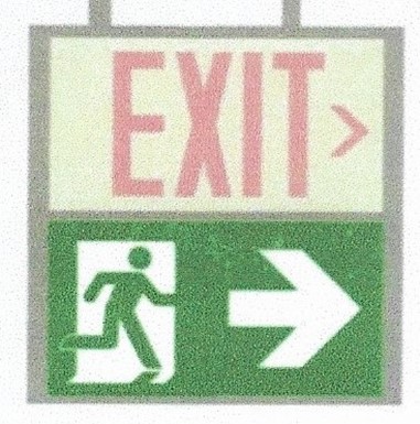 Picture 3 - proposed sign containing arrows combined with the ISO 7010 moving person symbol - does not meet requirements in NFPA 170
