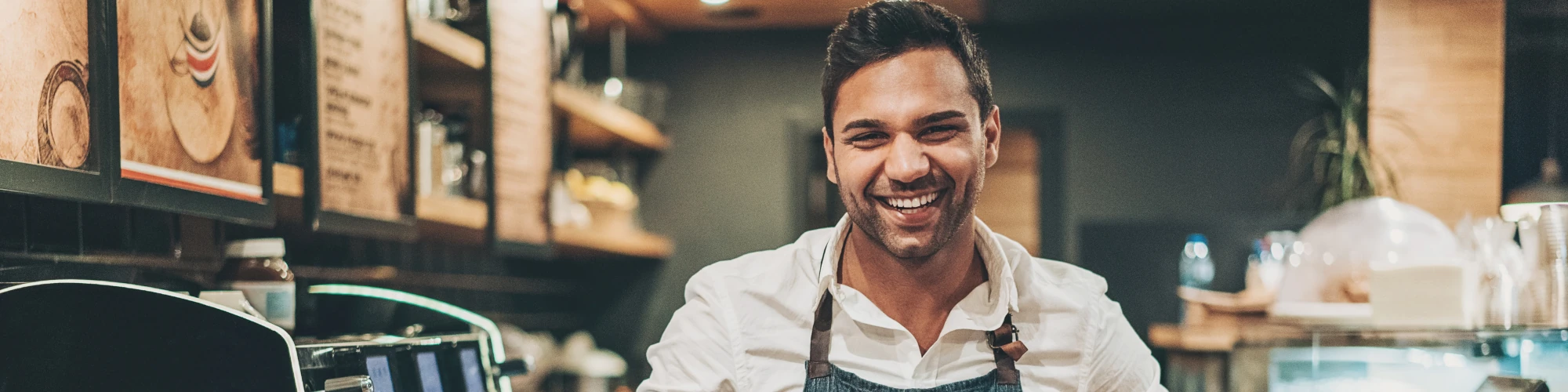 Coffee shop worker smiling