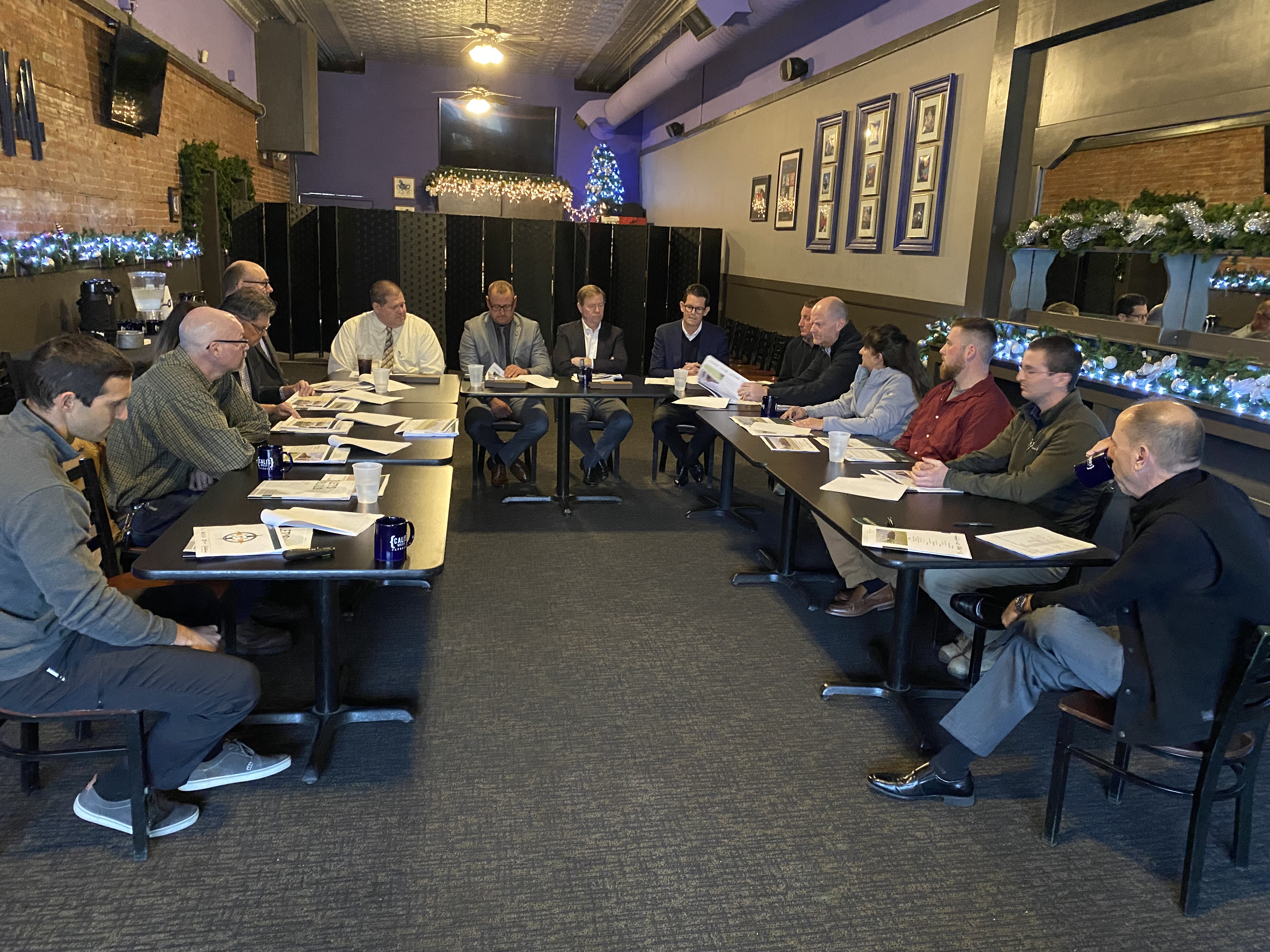 OSHA and the Partnership participants discuss the P.J. Dick Incorporated-Pennsylvania State University Erie Hall Replacement Building Partnership during the agreement signing ceremony.