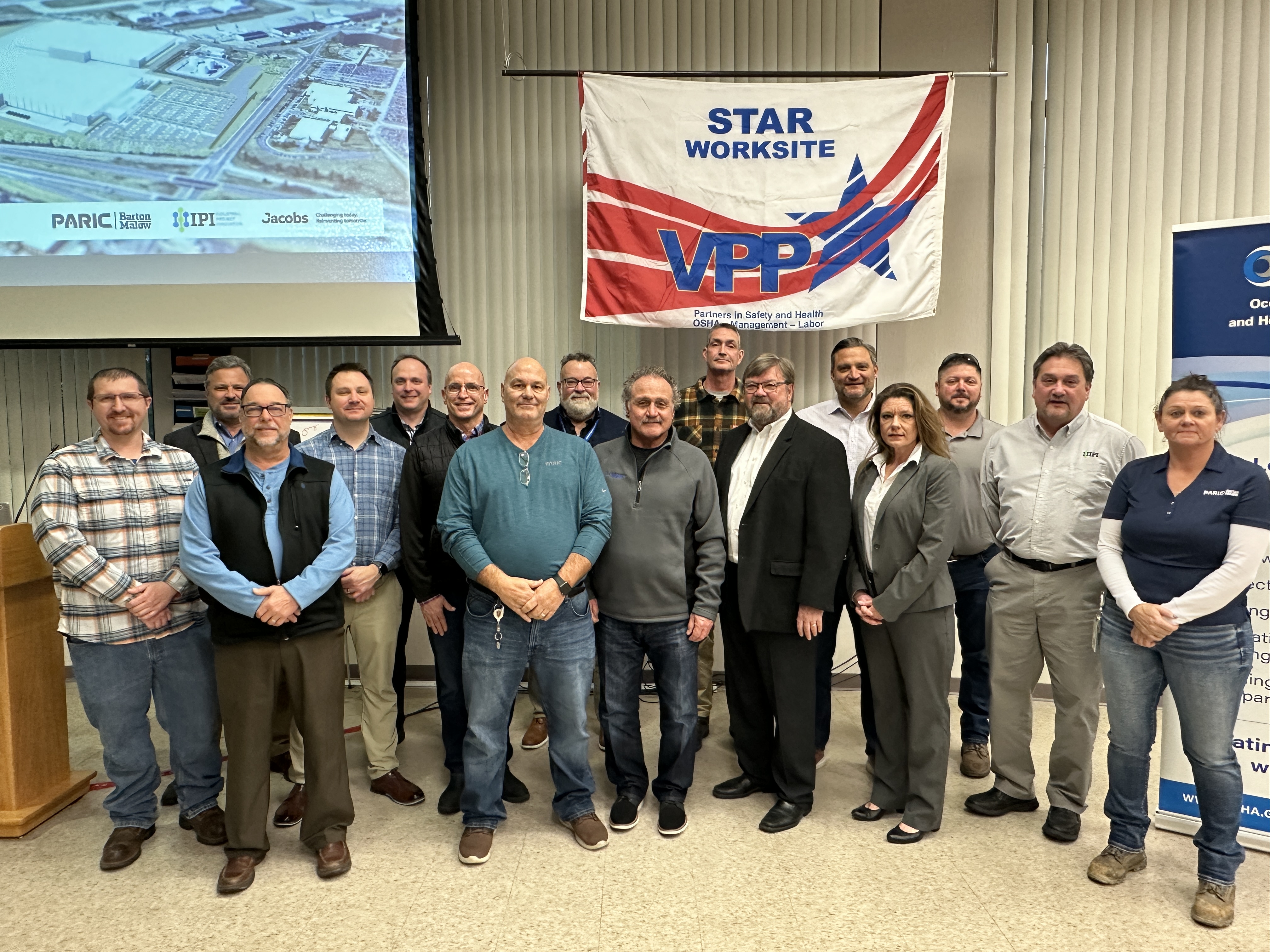 Partnership participants pose with a VPP Star flag hanging in the background for a group photo after the signing ceremony on January 23, 2024.