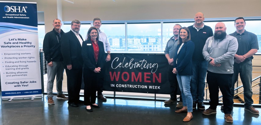 William McDonald, St. Louis Area Office Director, US DOL-OSHA, OSHA staff and representatives from McCarthy Building Companies stand for a group photo after the signing ceremony. 