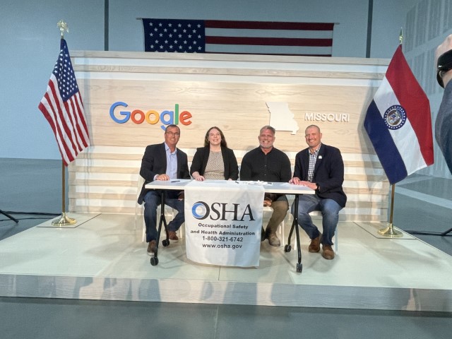 Joe Rodriguez, Global Earthworks & Underground LLC; Rebecca Hart-Schmidt, OSHA; Albert Jotautas, Mid-America Carpenters Regional Council; and Kevin Sears, J.E. Dunn Construction Company sign the partnership agreement.