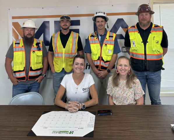 Attendees to the Partnership agreement signing ceremony pose for a group photo, after the signing ceremony.