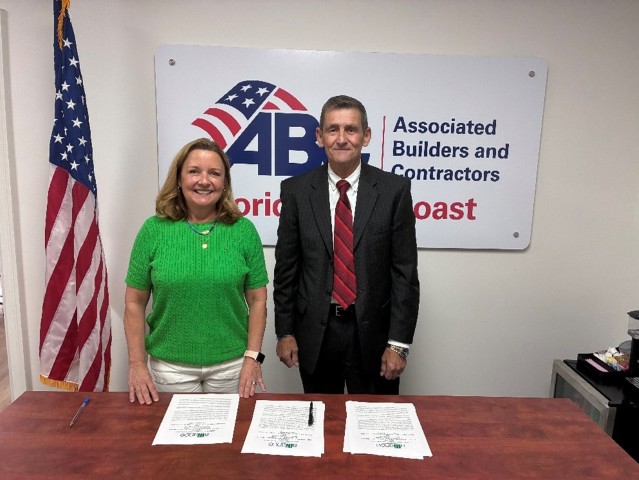 •	Left Standing – Karen Tucker Hoffman Right Standing - David (Scott) Tisdale, Jacksonville Area Director