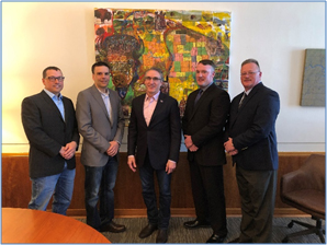 From left: Jesse Olson and Jason Tuhy of the Whiting Petroleum/Bakken Basin Safety Consortium; North Dakota Governor Doug Burgum; OSHA Bismarck Area Office Director Scott Overson; and OSHA Bismarck Assistant Area Director John Young gathered to sign an alliance to promote safety and health in the North Dakota oil and gas industry.