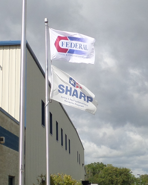 Federal Tool &amp; Engineering LLC (FTE) prominently flies the SHARP flag outside its facility in West Bend, WI.