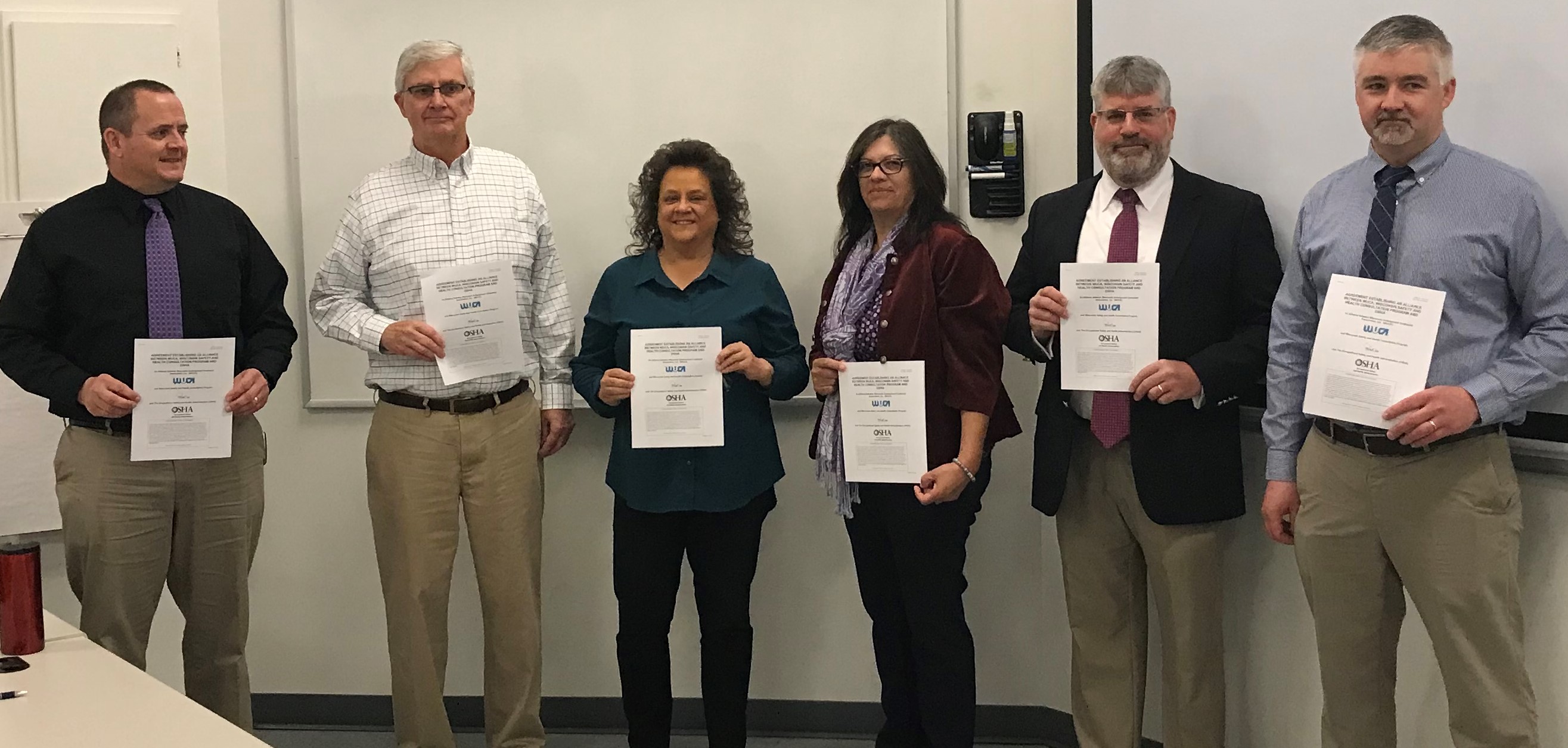Wisconsin Safety and Health Consultation Program and the Wisconsin Underground Contractors Association, Inc. Signing Photo