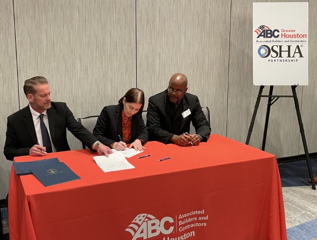 Seated at a table Michael Richter, President & CEO, ABC, Greater Houston Chapter; Larissa Ipsen, Area Director, Houston South Area Office, OSHA and Mhekeba Hager, Area Director, Houston North Area Office, OSHA, sign the Partnership agreement. 