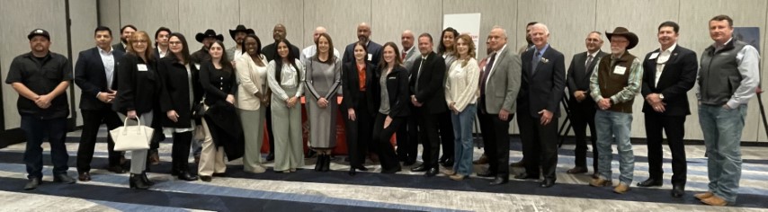 The signing ceremony attendees pose for a group photo before the ceremony concluded.