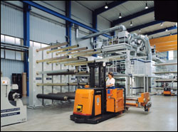 Figure 24. Programmable floor tram to transport sleeves and cylinders.