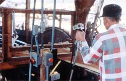 Bolter sawyer at log (bolt) carriage controls.