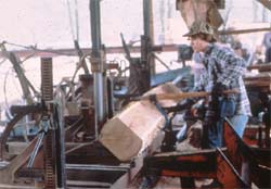 Manually turning the cant for the next cut.