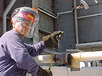 Figure 5: Worker brazing with face shield and safety glasses