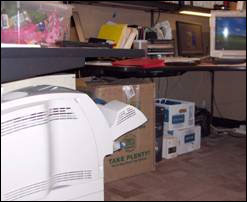 Figure 5. Clutter under work top limits space for legs and chair positioning