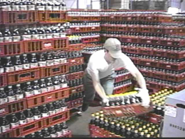 Pallets are not stored in racks in this system. Product is directly transferred on the dock or warehouse floor.