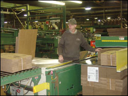 Figure 42. Feed and take off tables can be adjusted to a coordinated height that minimizes awkward postures and lifting.