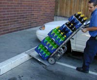 Fig. 4: Moving the load over the curb with the ramp.