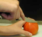 Dangerous cutting position with thumb in the cutting line