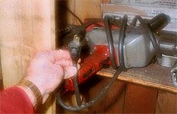 Ungrounded portable power tool in sawmill maintenance shop.