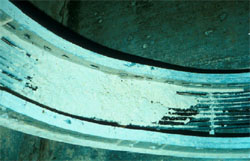 Wood dust in uncovered cable tray.
