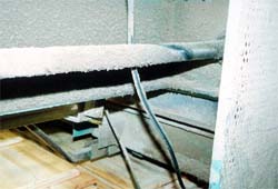 Rotating shaft abrading electrical cord.