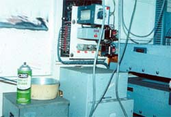 Improper storage of personal items in electrical cabinet.