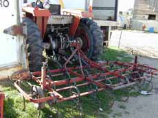 Tractor pulling farm equipment