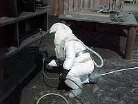 Figure 7: Painter with protective suit and boot covers