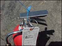 Figure 2. CO2 fire extinguisher with seal and inspection tag.