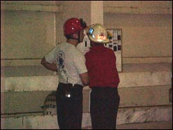 Figure 2. Fire department workers reviewing emergency escape plan.
