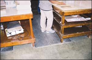 Figure 21. Use of floor mats may relieve back pressure.