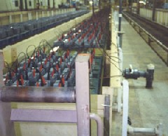 Batteries being charged in the wet formation process