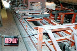 Secured entrance to log carriage travel area #1