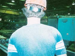 Wood dust shown on worker.