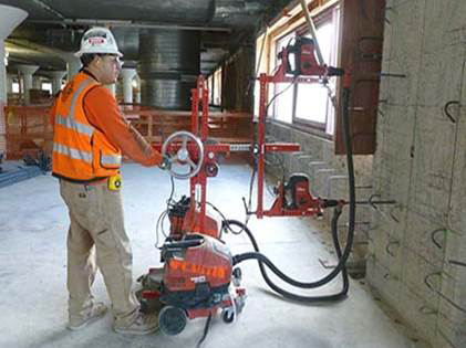 Contractors adopt innovative concrete drill jig to reduce silica exposures during concrete drilling operations. | Source: UC Ergonomic Research and Graduate Training Program