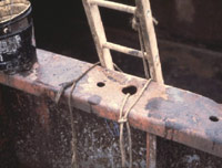 Figure 8: Hand line near portable wood ladder for raising and lowering tools, etc. to allow hands free for climbing