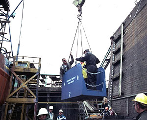 Image of two workers on a suspended scaffold