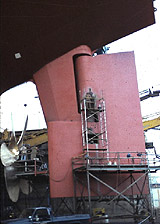 Figure 7: Worker on independent metal pole scaffold protected with guardrails