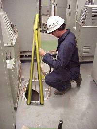 Figure 8: Marine Chemist testing confined space prior to entry
