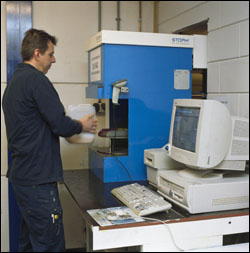 Figure 28. Some systems dispense into smaller-one or two-gallon jugs which are lighter and easier to handle. Proper lifting and carrying techniques should be used.