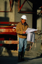 Inspector reviewing paperwork on-site