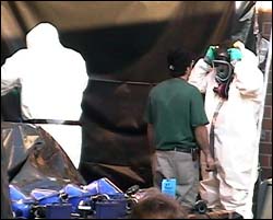 Men wearing hazard suits