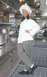 Image a young worker standing on a non-slip mat