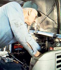 Figure 13. Trained and authorized mechanic performing regularly scheduled maintenance.