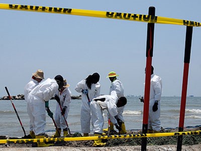 Removing oiled materials by hand