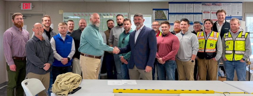 Matthew Thurlby, Area Director, Omaha Area Office, US DOL-OSHA, with representatives from Nebraska On-Site Consultation and Hausmann Construction Group, pose for a group photo after signing the Partnership agreement.   