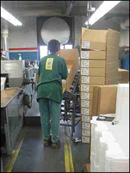 Figure 45. Use a packing stand to reduce wrist and torso and bending.