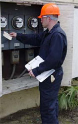 Worker wearing flame-resistant clothing