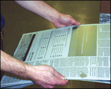 Figure 7. Proper way to hold plates, eliminating the use of pinch grip.