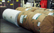 Figure 11. Staging rolls by hand requires physical strength. Double- wide rolls weigh up to 1,800 lbs. Most injuries occur when trying to turn rolls or stop runaways.